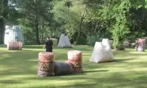 A group of laser tag barriers set up in a park.