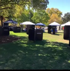 A group of laser tag barriers in a grassy area.